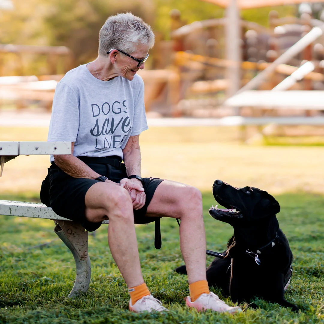 Woman wearing Dogs Save Lives Shirt