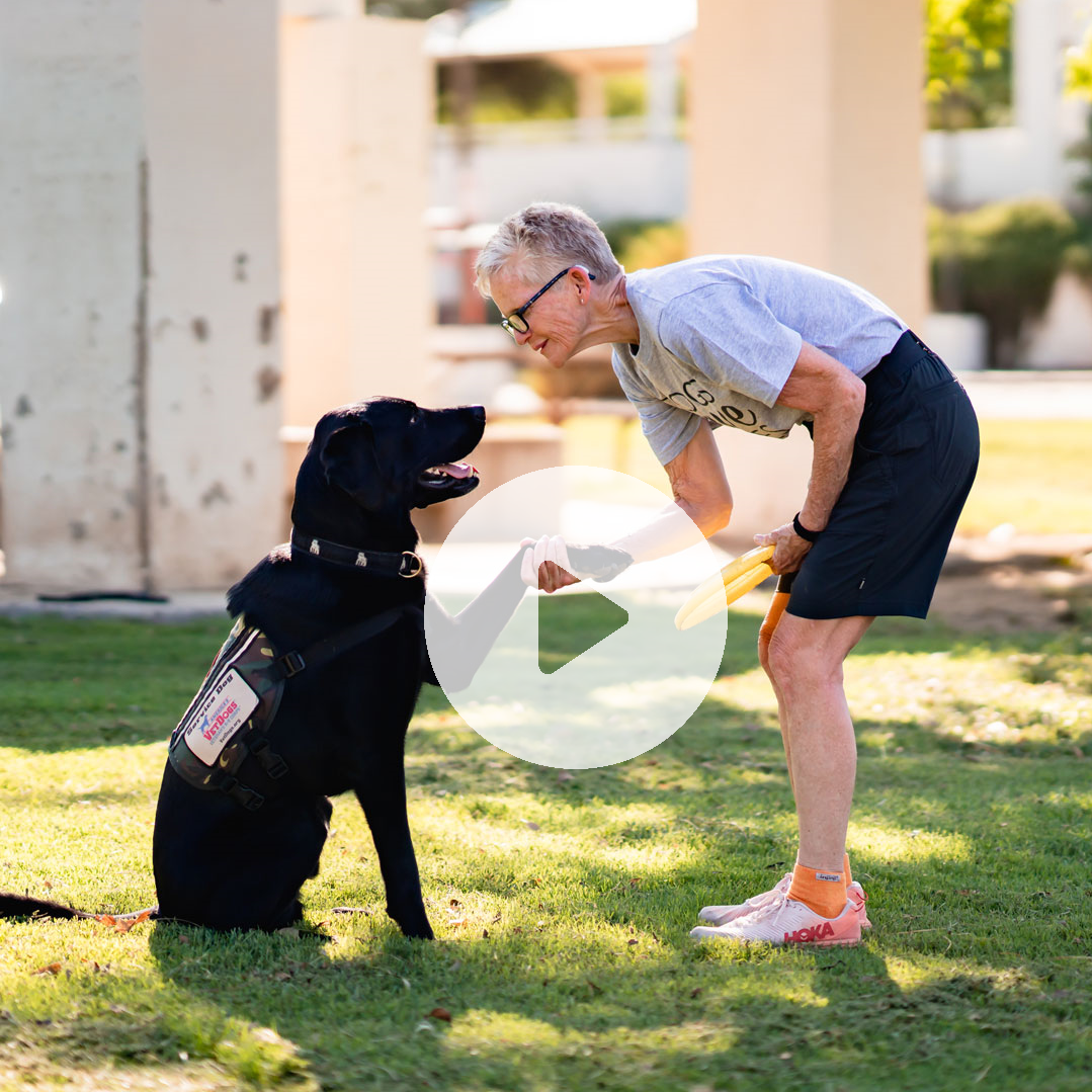 Woman wearing Dogs Save Lives Shirt with dog